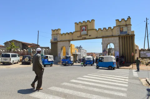 The iconic Harar Gate (Duke's Gate) with crenellated white towers and stone-paved plaza