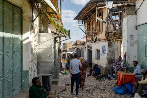 People gathered in a busy alley of the old town bazaar